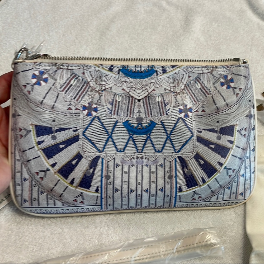 Camilla Singing Wells leather clutch with shoulder and wrist straps